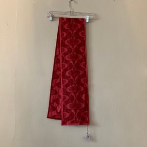 Coach scarf. Measures 60”x7.5”. Shimmery fabric.